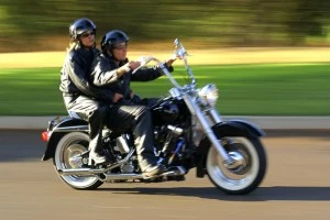 Couple riding motorcycle
